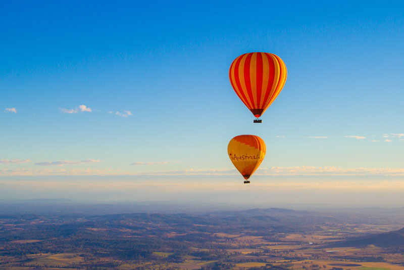 Two hot air balloons flying