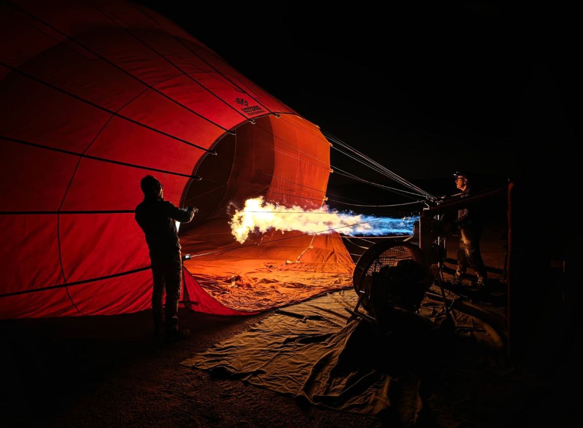 Hot air balloon inflating at dawn at the Mareeba launch site