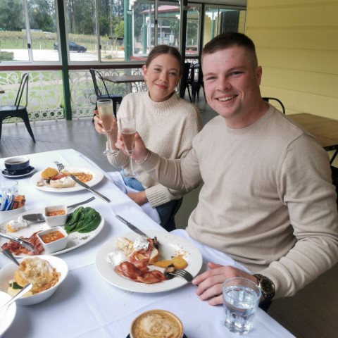 Jackson and Georgina engagement celebrating at breakfast