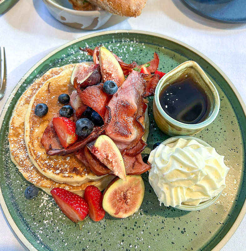Breakfast pancakes with bacon, figs, berries and cream at Rainforest Restaurant Tamborine Mountain