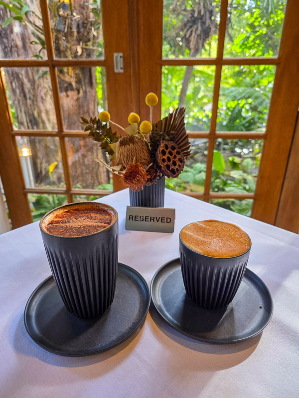 Coffee at Rainforest Restaurant Tamborine Mountain - table reserved for Hot Air guests with rainforest backdrop