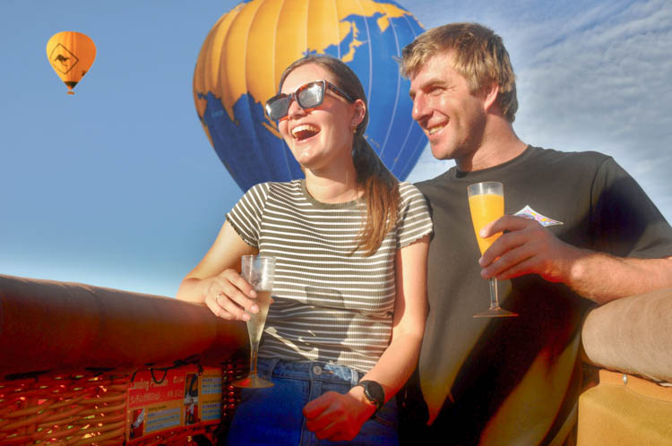 Couple enjoying a celebratory post-flight toast