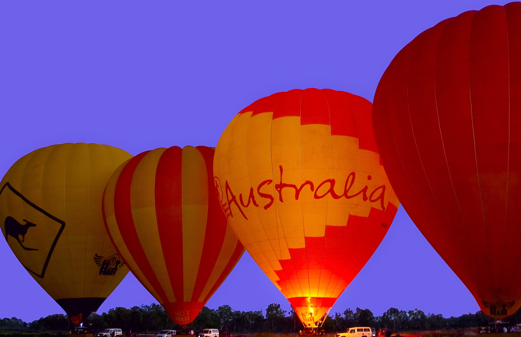 four hot air balloons ready to take off