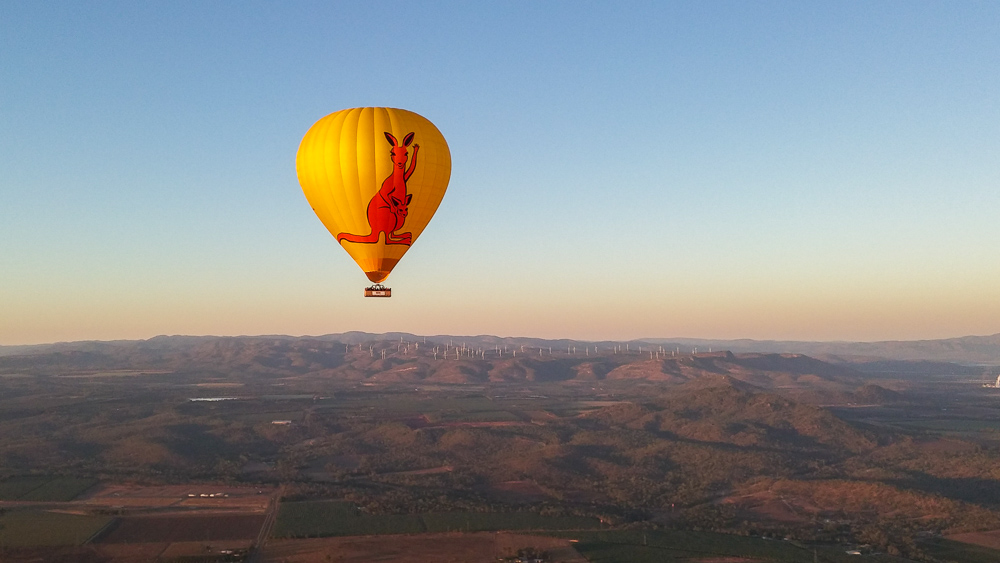 Hot Air Balloon drifting at sunrise over the Atherton Tablelands