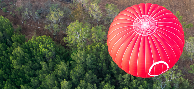 Birds eye view of a hot air balloon flying over Mareeba Atherton Tablelands landscape