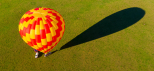 Looking down on a hot air balloon from above the Gold Coast Hinterland