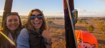 exciting girls are on a hot air balloon